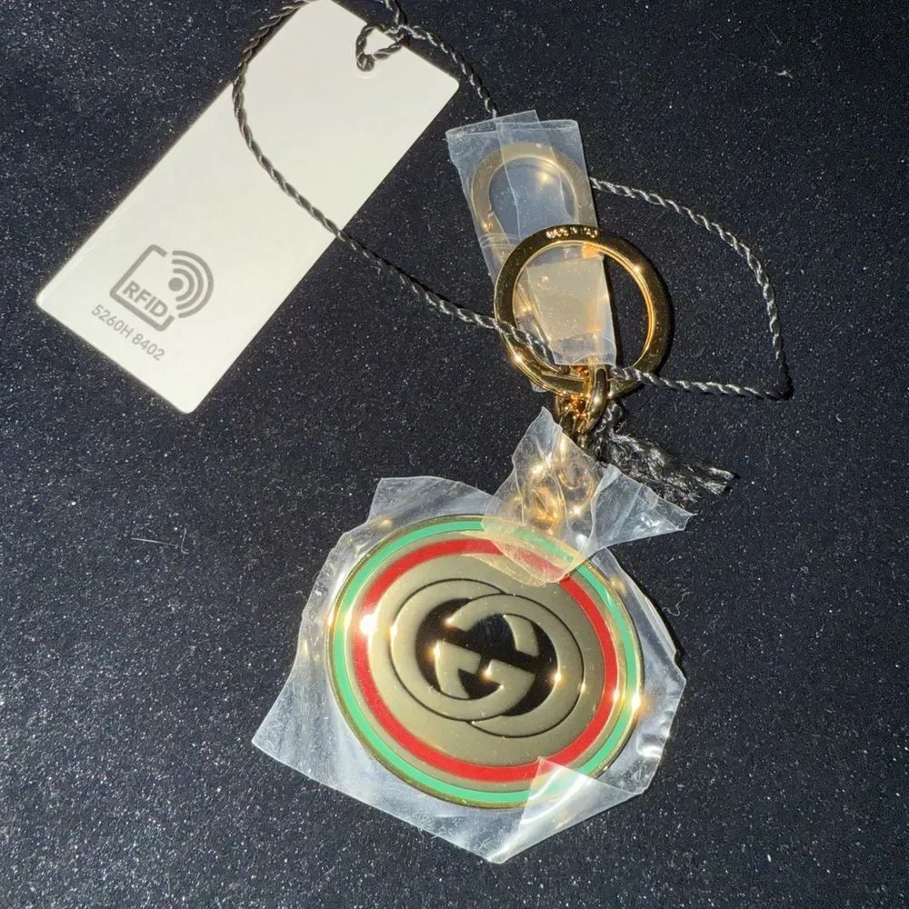 Brand new with box and dustbag Gucci Gold and Green Keychain